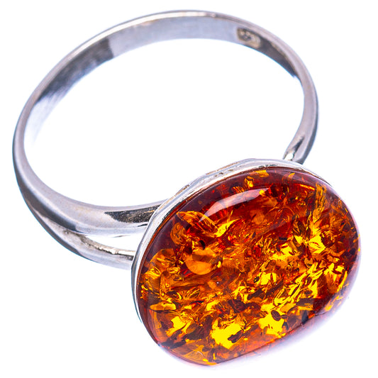 Oval amber cabochon ring with .925 sterling silver open band, reflective setting