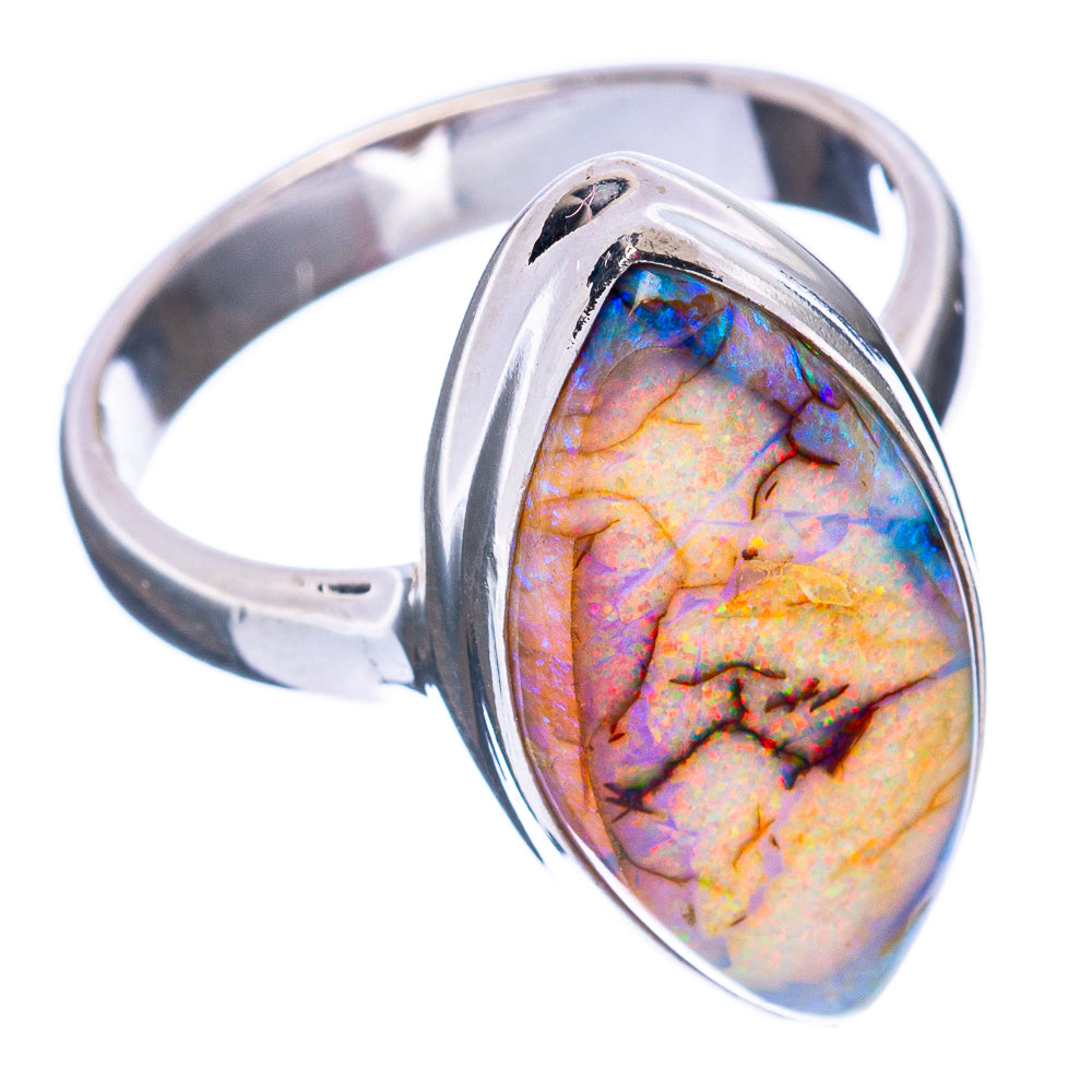 Sterling silver opal ring with oval multicolor stone, side angle on band