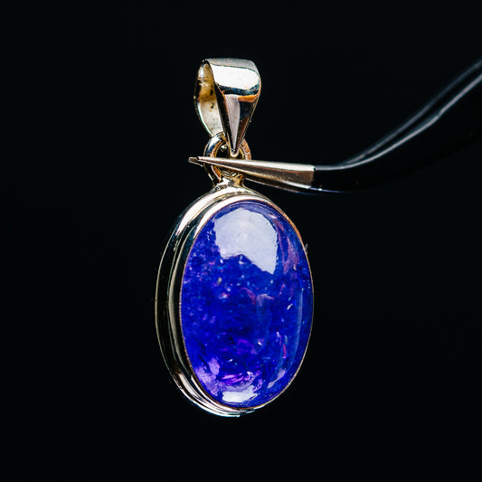 Sterling silver tanzanite pendant with oval blue stone in bezel and hanging bail