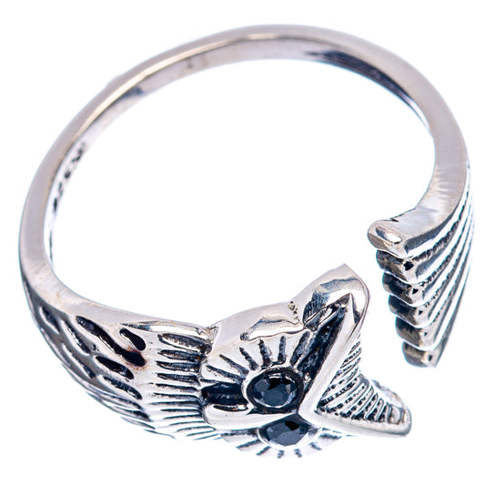 Sterling silver owl ring top view with dark gemstone eyes and textured wings