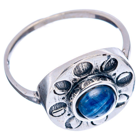 Sterling silver ring with blue kyanite cabochon and floral edge detailing