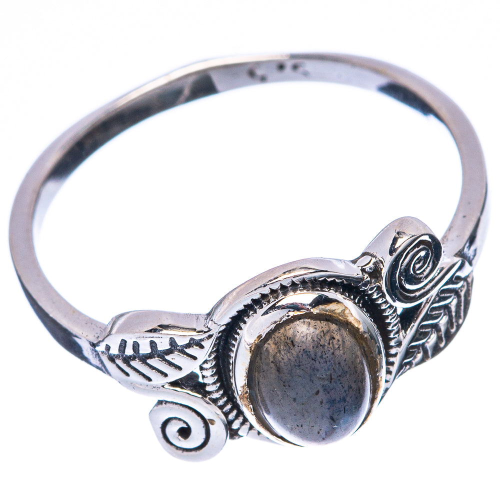 Sterling silver ring featuring oval labradorite cabochon and scrolling leaf engraving