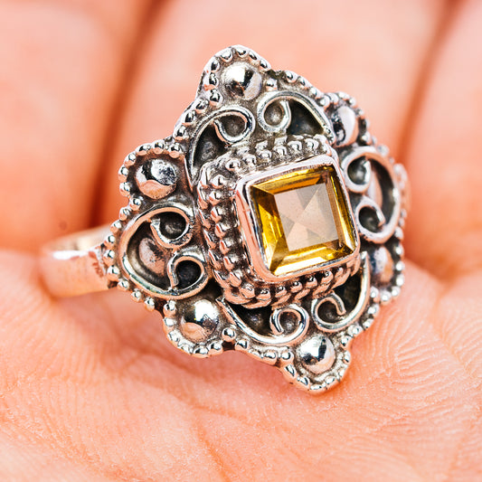 Sterling silver filigree ring with square citrine-style gemstone, angled side view