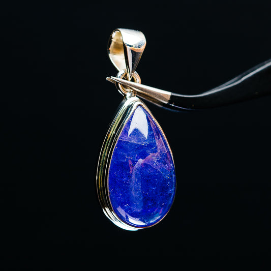Sterling silver teardrop pendant with large blue tanzanite gemstone, hanging bail