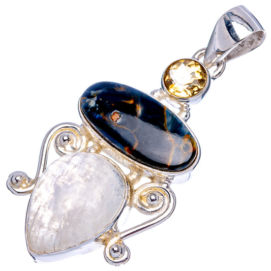 Sterling silver pendant with oval blue gemstone, oval iridescent stone, and round yellow top
