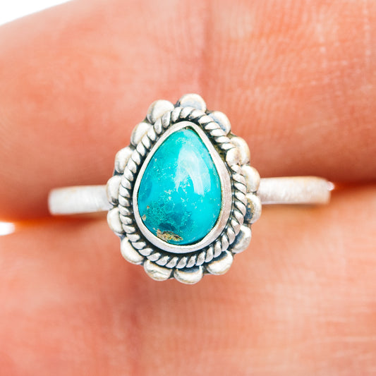 Sterling silver turquoise teardrop ring, ornate rope bezel and raised setting