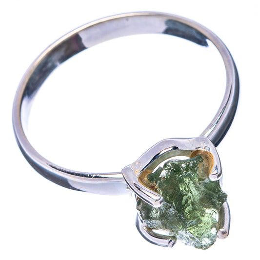 Sterling silver band with open prong setting holding rough green stone