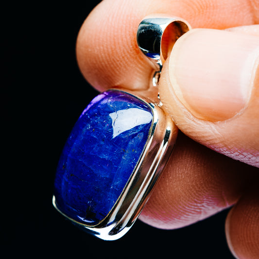Sterling silver blue tanzanite cabochon pendant, side view of bail and bezel
