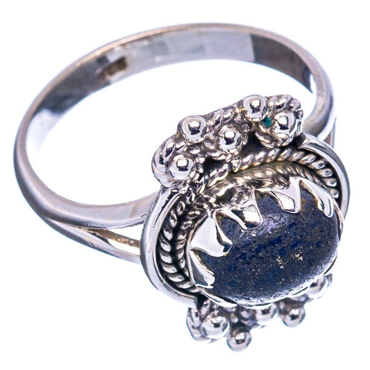 Sterling silver ring with oval dark blue lapis and detailed filigree side floral motifs