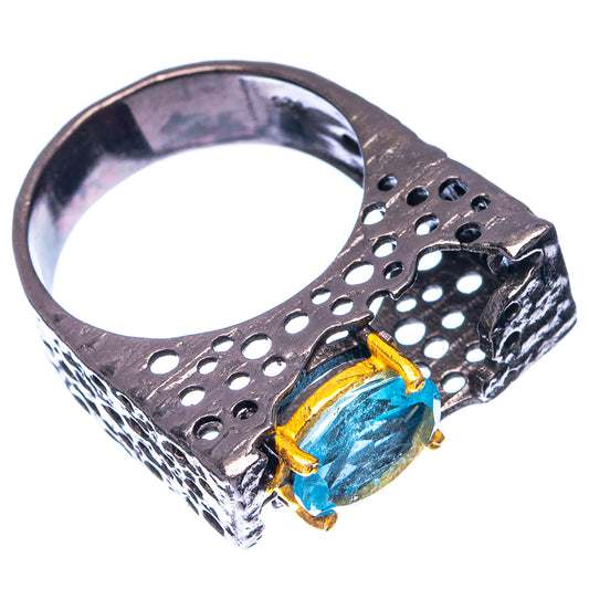 Sterling silver ring with oval blue gemstone and perforated blackened band