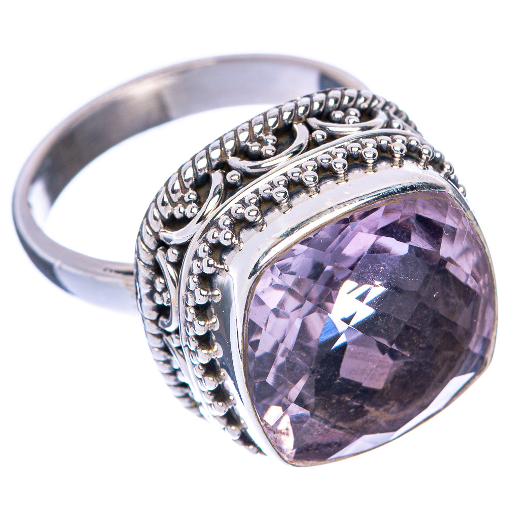 Sterling silver oval amethyst ring with faceted purple stone in ornate bead and scroll setting
