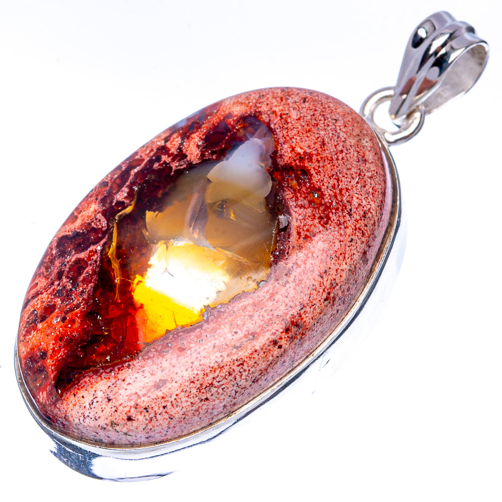 Teardrop fire opal pendant, red speckled stone with glowing amber center, sterling silver frame