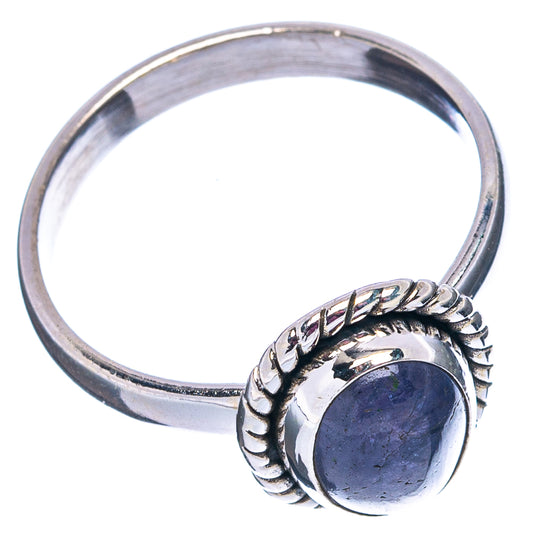 Sterling silver tanzanite ring with wide band and oval dark-blue gemstone bezel