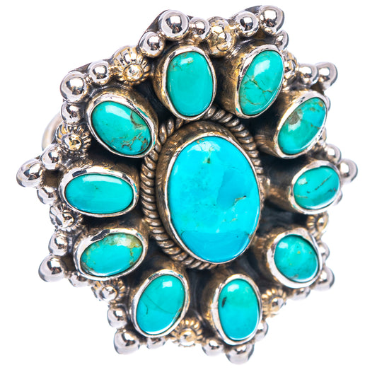 Sterling silver ring showing turquoise oval cabochon cluster in ornate silverwork
