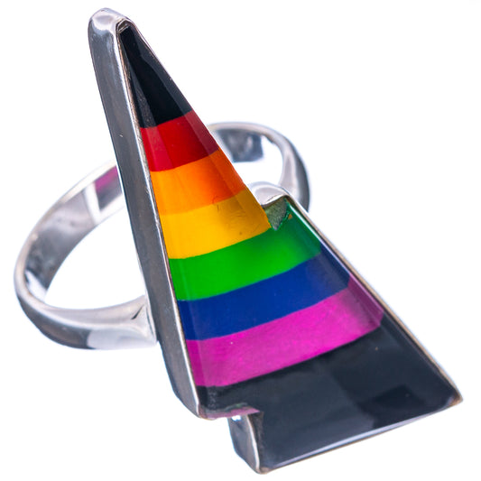 Sterling silver ring with tall rainbow-striped bolt centerpiece on black base, silver band visible