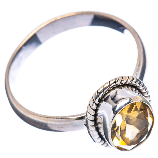 Sterling silver citrine ring with oval yellow gemstone and braided band
