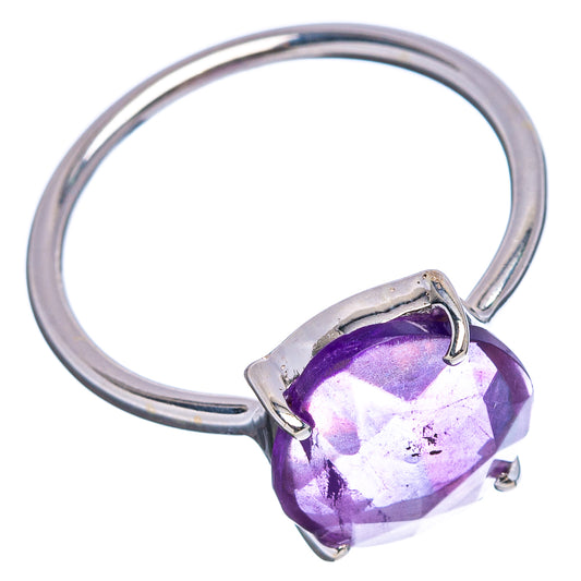 Sterling silver ring with faceted purple amethyst stone in corner prongs, side view