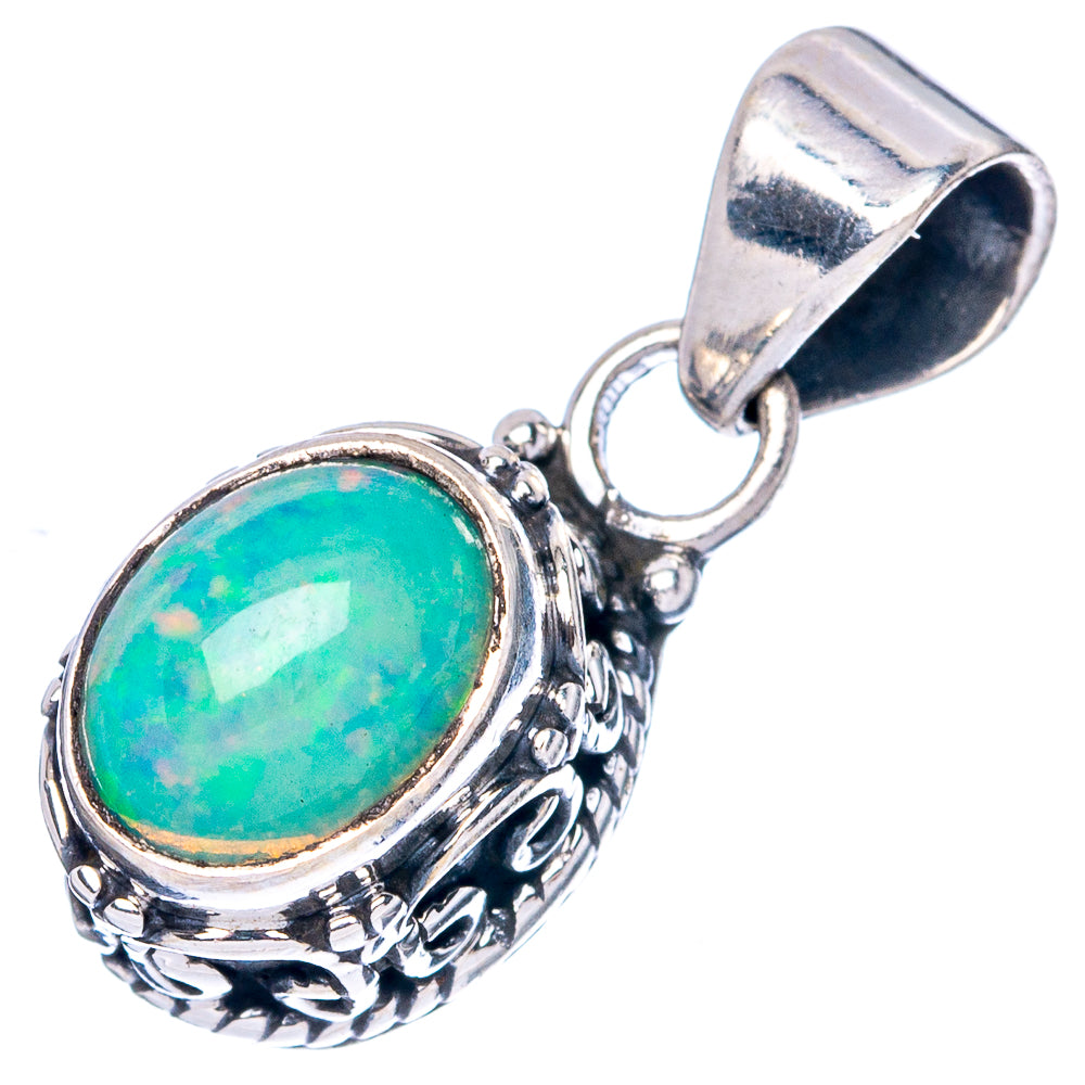 Oval green opal pendant with ornate sterling silver filigree and hinged bail