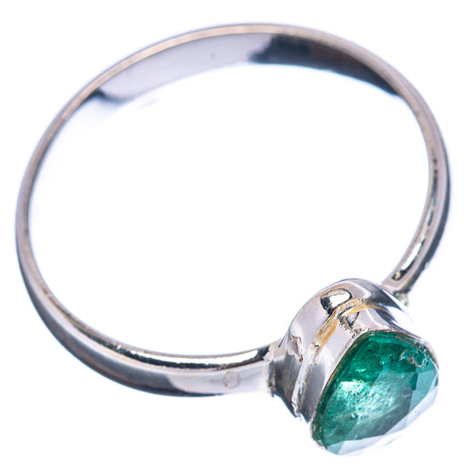 Sterling silver emerald ring, round bezel with green gemstone, angled side view