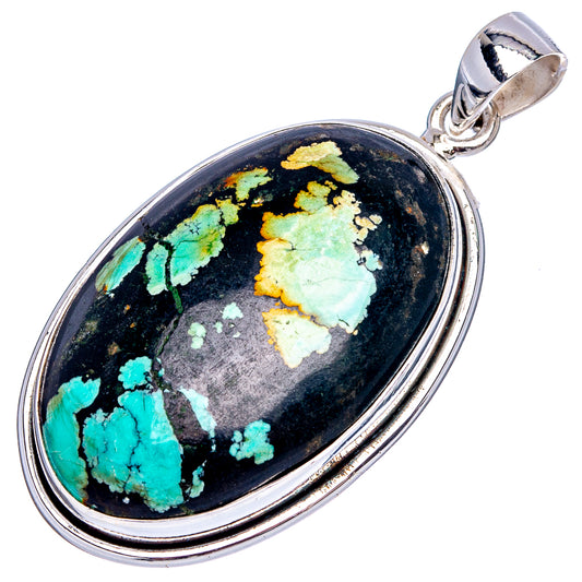 Oval turquoise pendant in sterling silver with black matrix stone and side bail
