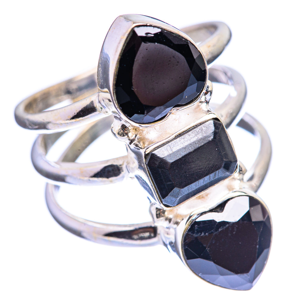 Sterling silver ring with three black faceted stones in a geometric open setting
