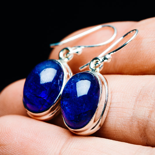 Blue oval tanzanite earrings with polished .925 sterling silver settings and hooks