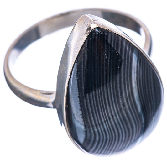 Sterling silver band ring with dark oval cabochon stone, striped sheen