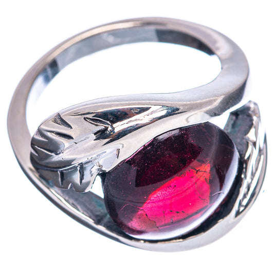 Sterling silver garnet ring, rounded bezel gemstone with pink-red flash