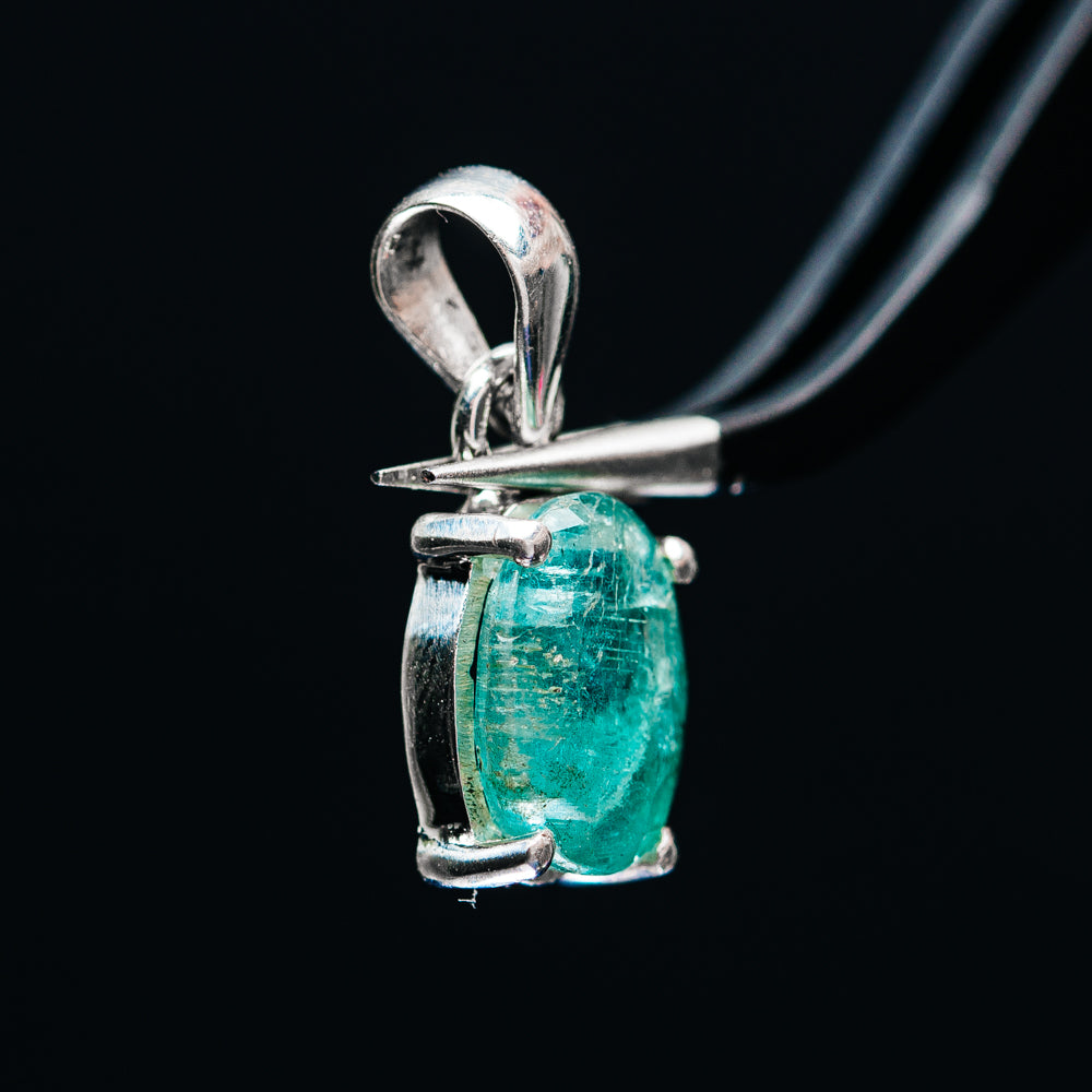 Sterling silver emerald pendant, side view with square bezel frame and loop bail