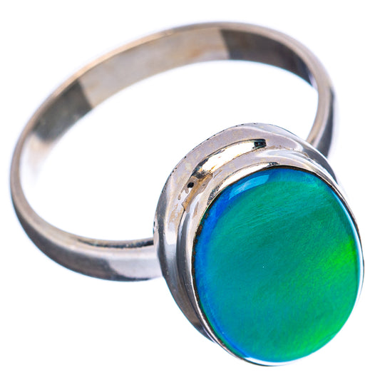 Sterling silver opal ring with oval green-blue cabochon, raised bezel profile