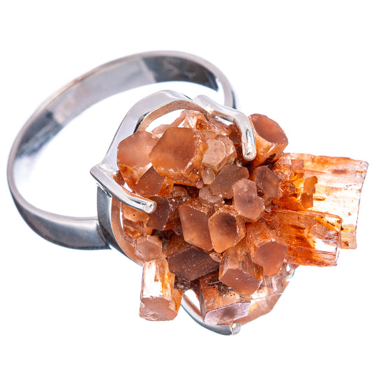 Sterling silver ring with raw orange aragonite crystal cluster, open-work prongs