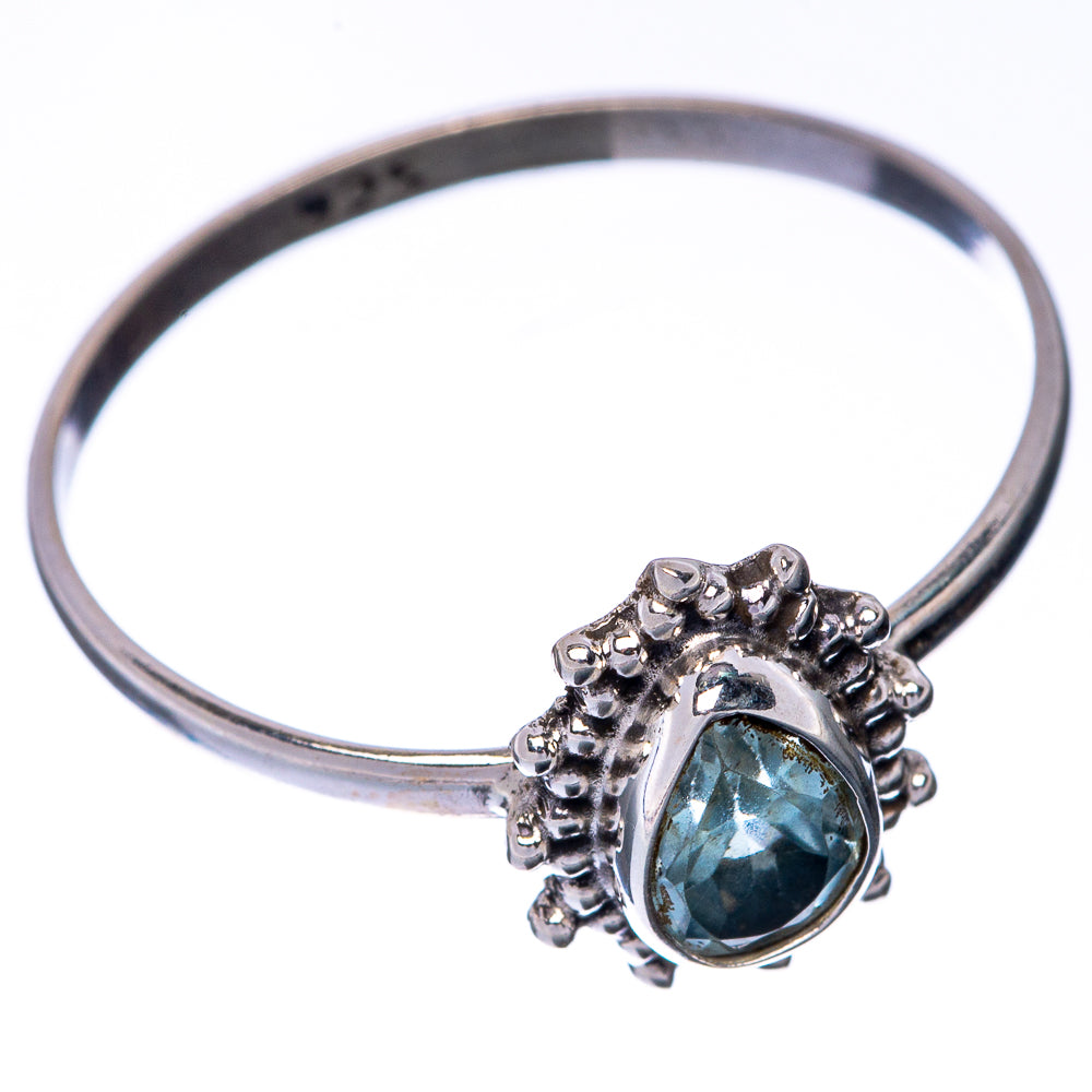 Sterling silver ring with oval blue gemstone, small bead halo, thin band view