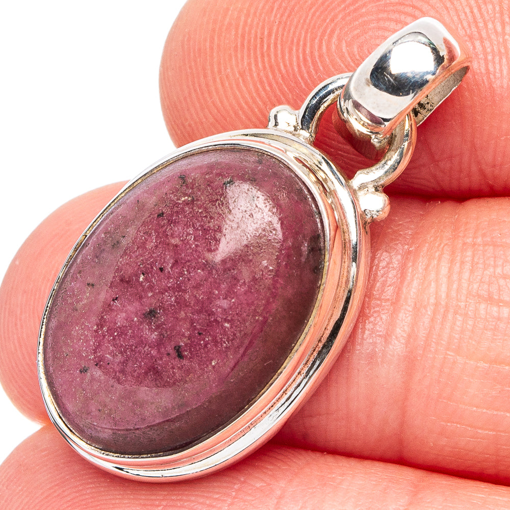 Oval rhodonite gemstone pendant in .925 sterling silver bezel with top loop bail