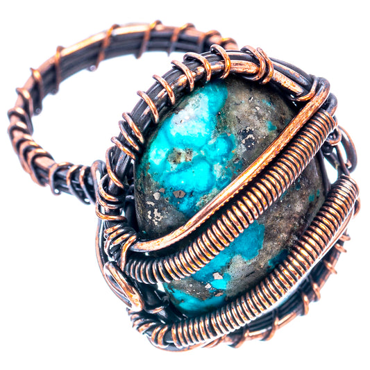 Turquoise wire-wrapped ring with oval cabochon stone, copper coils and dark leather band