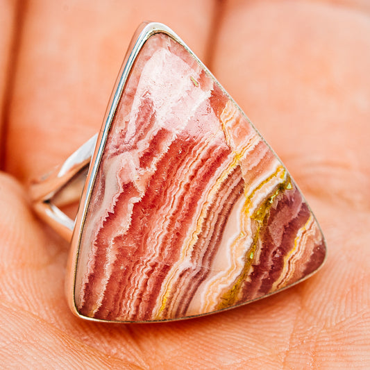 Sterling silver rhodochrosite ring with faceted oval pink stone and red-white bands