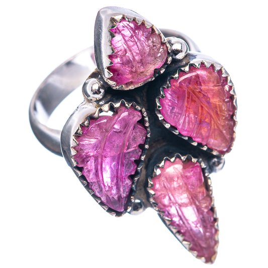 Sterling silver statement ring showing four marquise carved pink stones and open band