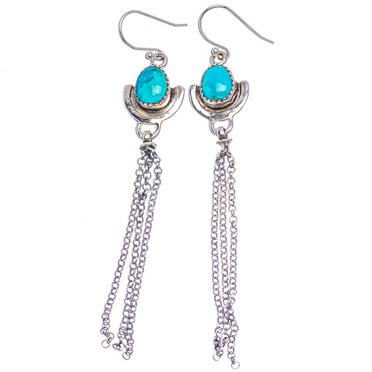 Sterling silver hoop earrings with bright turquoise cabochon and long chain drops