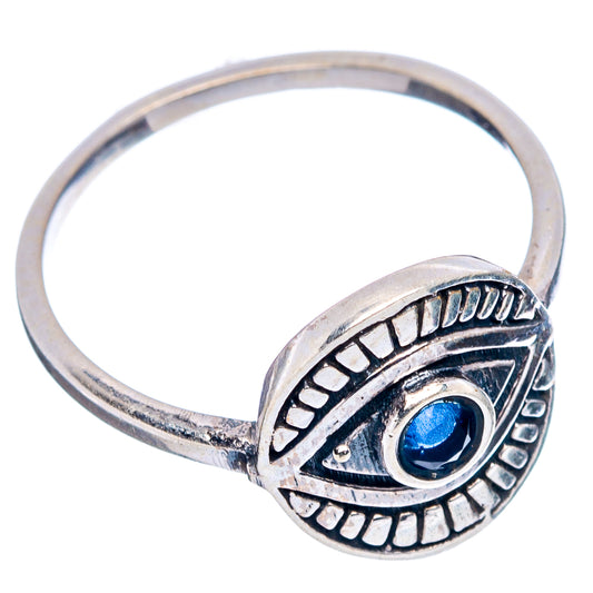 Sterling silver dainty eye ring with blue round gemstone and engraved side detailing.