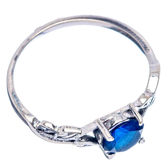 Sterling silver band ring with blue faceted gemstone detail, size 6.75