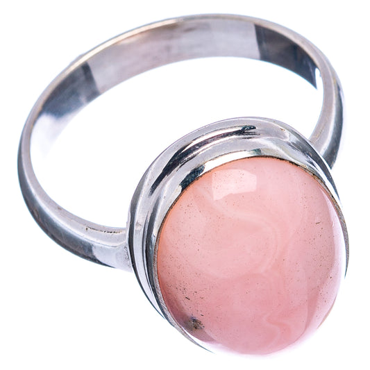 Pink opal oval cabochon sterling silver ring, size 8, angled view with shiny band
