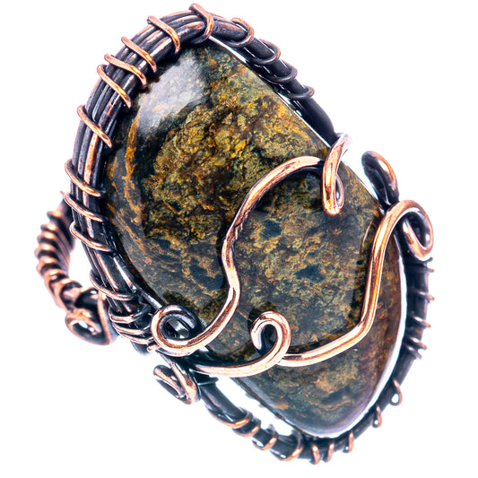 Oxidized copper wire wrap ring with oval green-gold agate stone, detailed wire loops