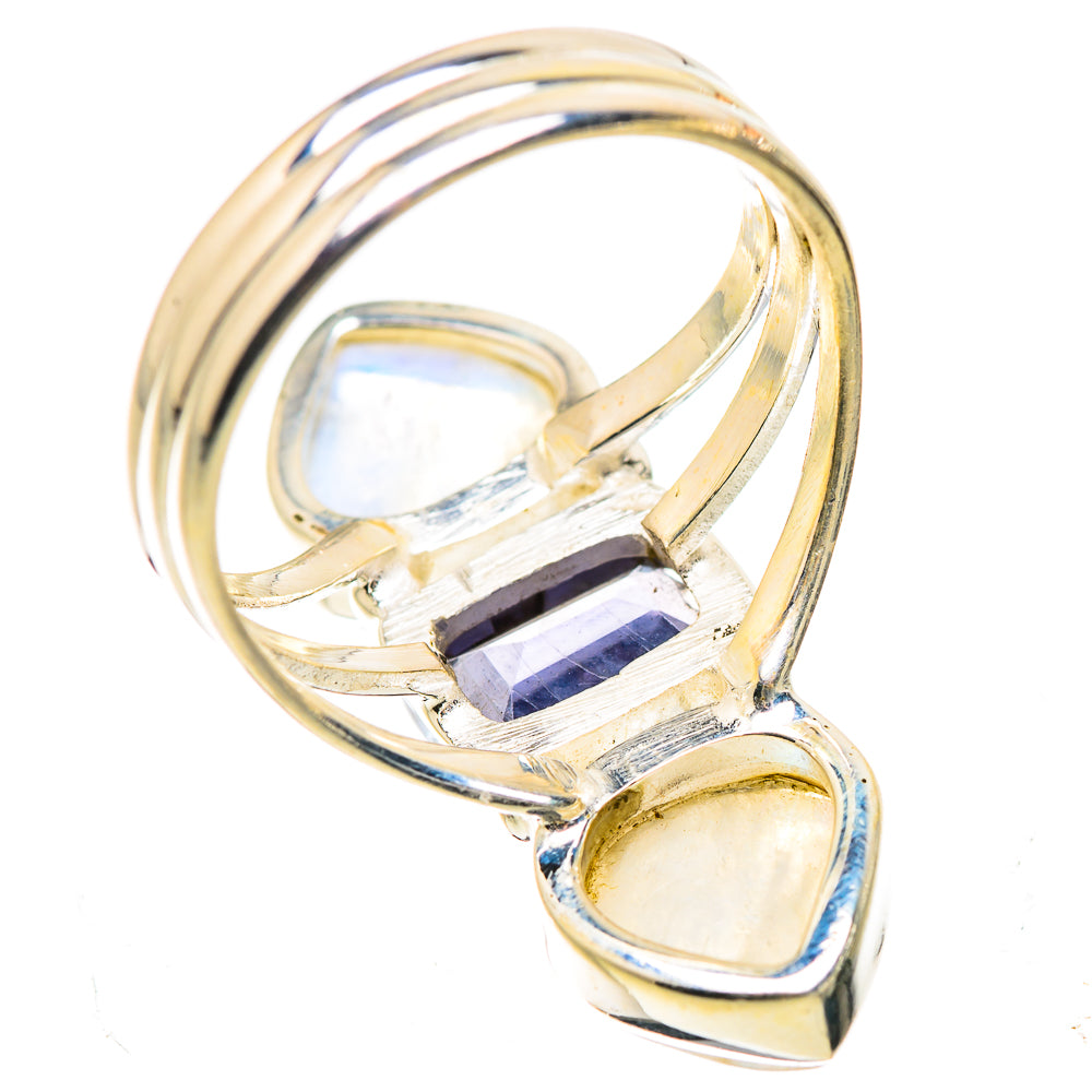 925 sterling silver ring with faceted purple center stone and two oval opal-like moonstones