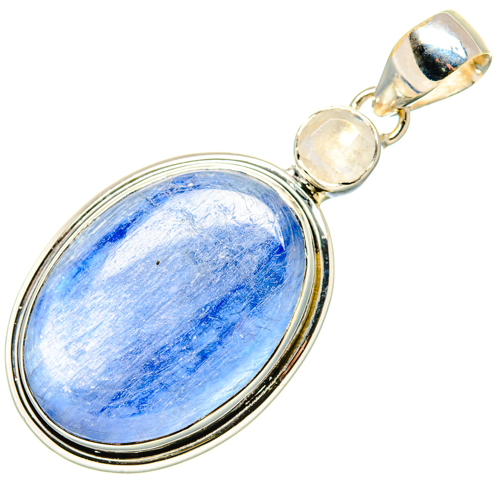 Sterling silver oval pendant with blue cabochon, round pale stones, and top bail