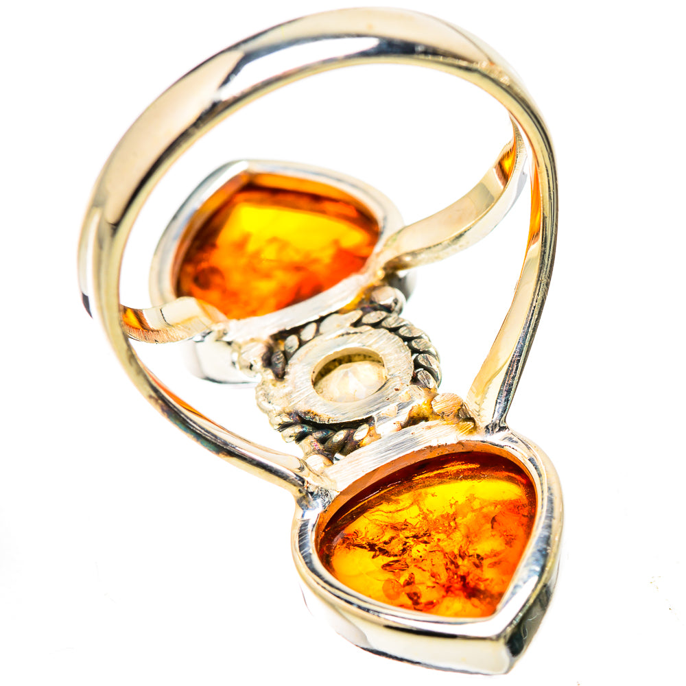 Sterling silver ring with amber teardrop stones and a round moonstone bezel setting
