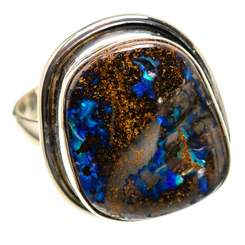 Sterling silver ring with oval boulder opal, blue flashes and coppery matrix bezel
