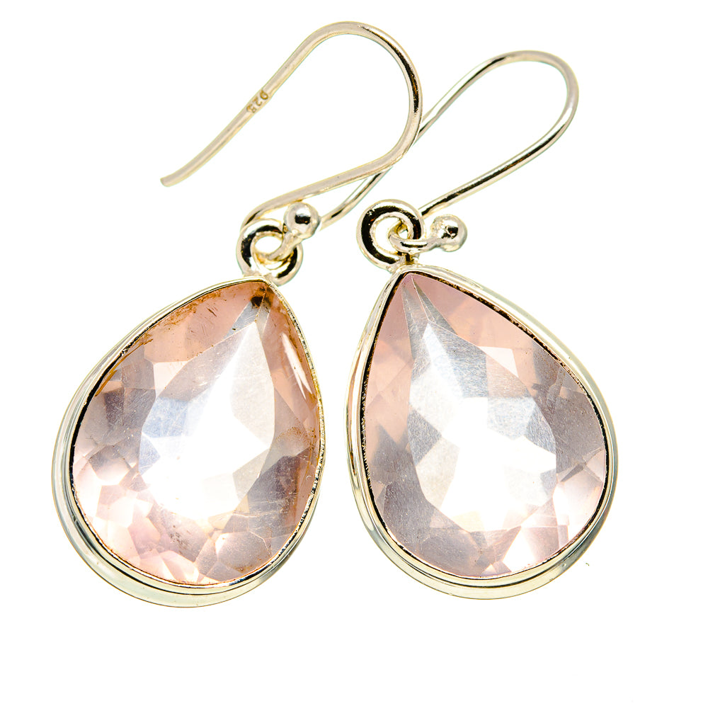 Sterling silver teardrop earrings with faceted pink stones and wire hooks