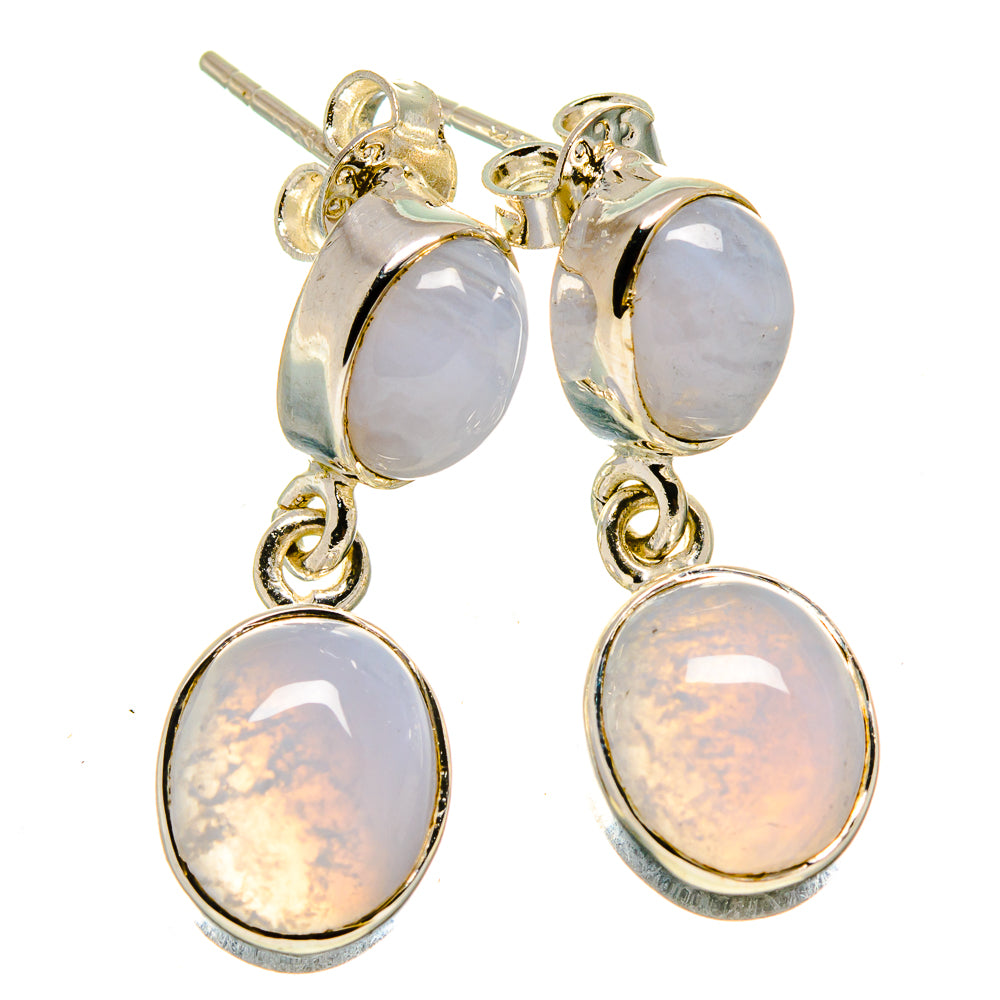 Gold-tone drop earrings with light lavender oval stones and silver ear posts