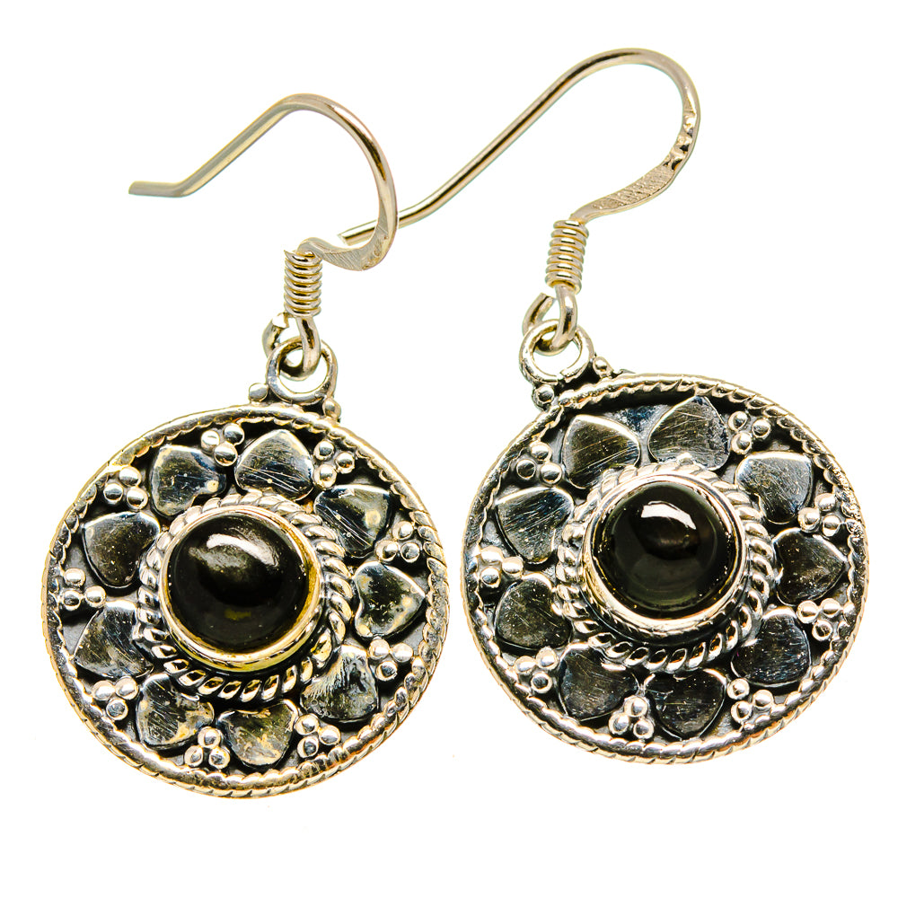 Round dangling earrings in silver tone with dark cabochon and blue stone frame.