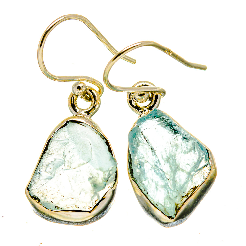 Pair of rough aquamarine earrings with gold-tone frames, dangling bezel-set teardrop stones