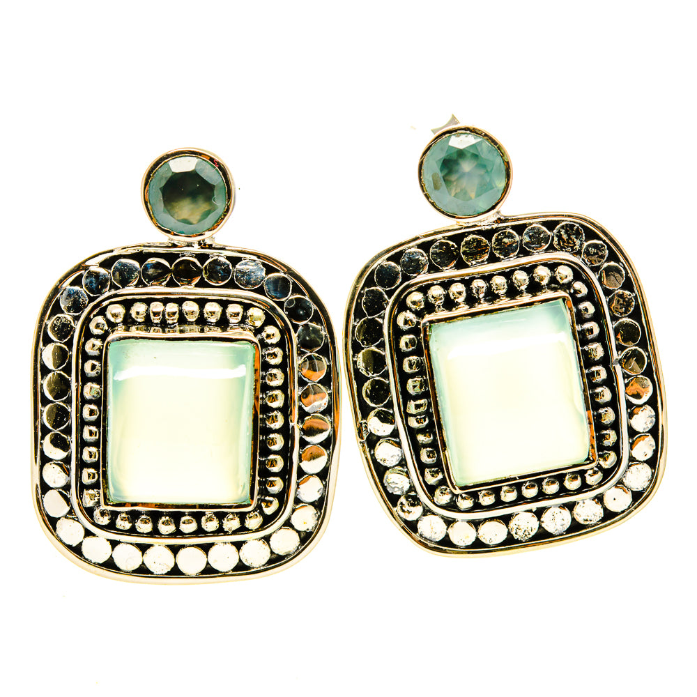 Ornate drop earrings with aqua square center stones, round tops, gold-tone bezel detail